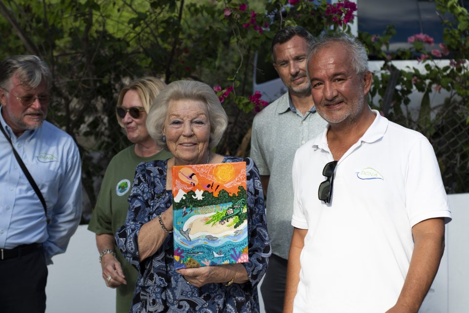 Princess Beatrix Accepting Dcna Gift Of Painting From Local Artist Dillon Rannou. Photo Credit Dcna And Jake Brass
